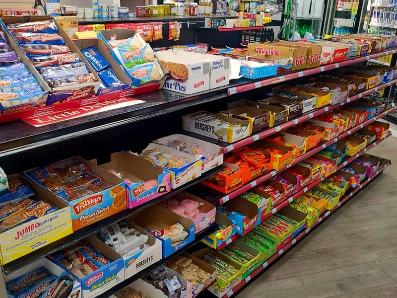 Snack & Go's candy aisle stocked with chocolate bars, Little Debbie snacks and candy